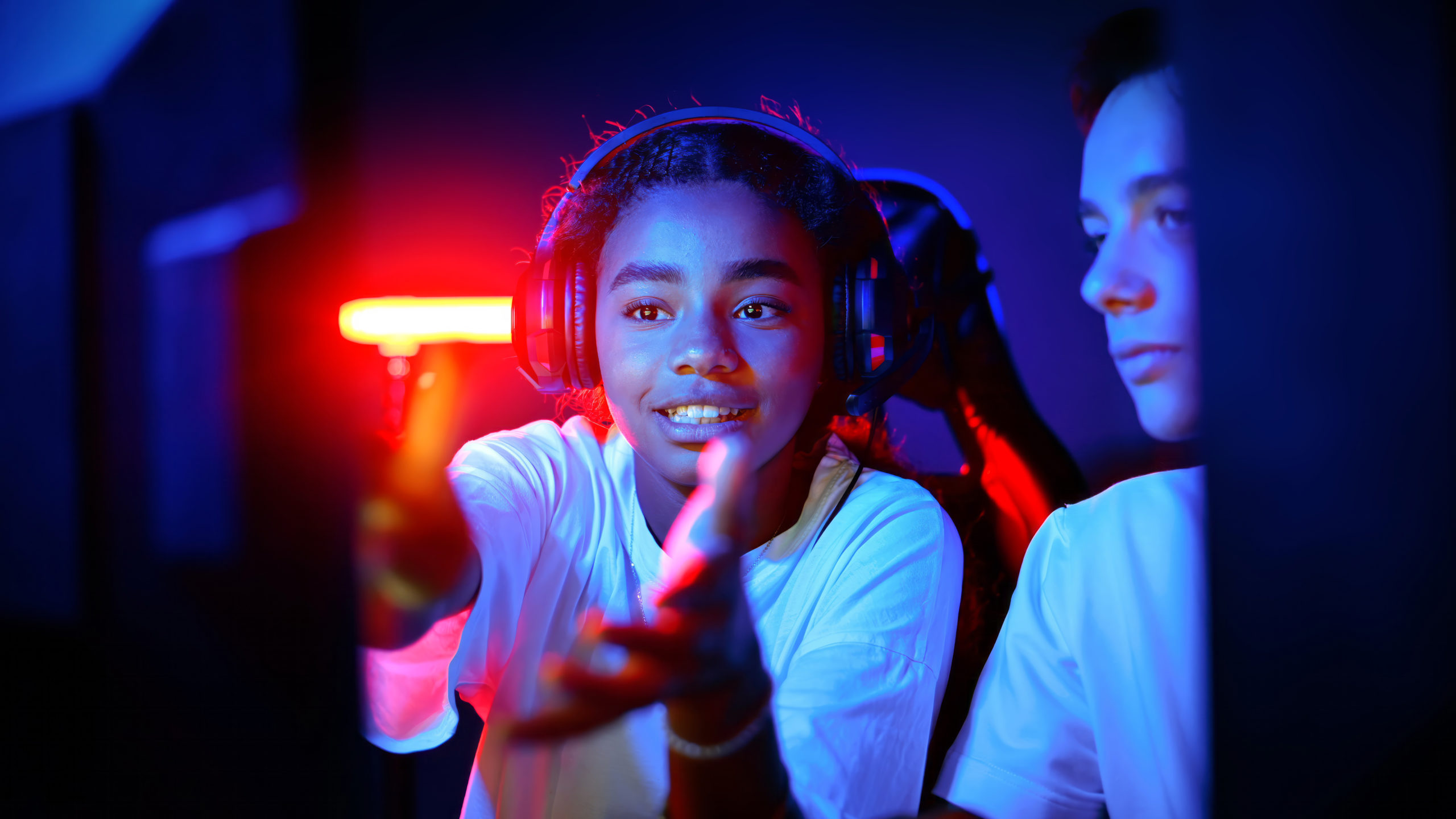 Teens playing in video game club